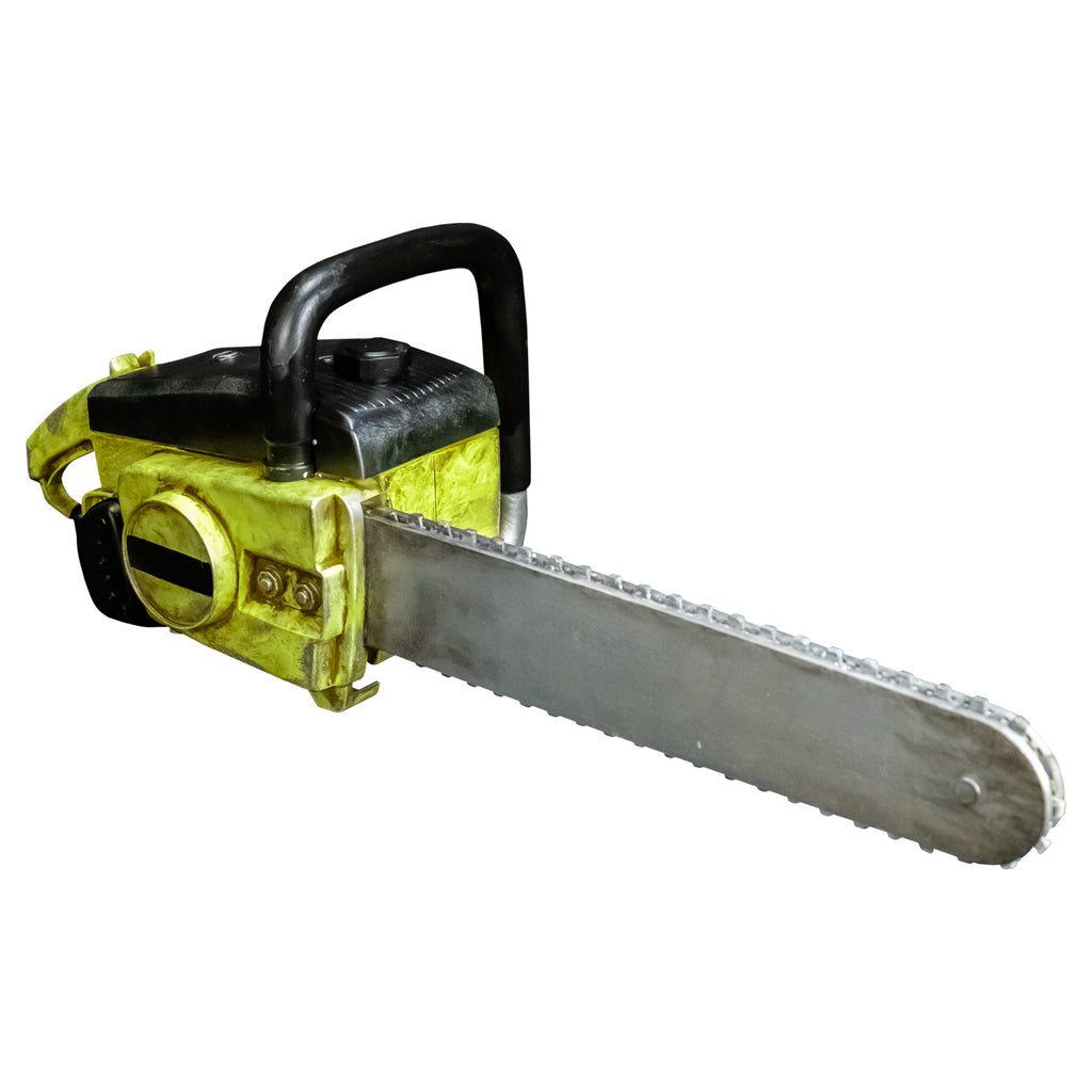 Chainsaw prop. Distressed weathered yellow and black body. Black and silver handle. Silver bar and chain.