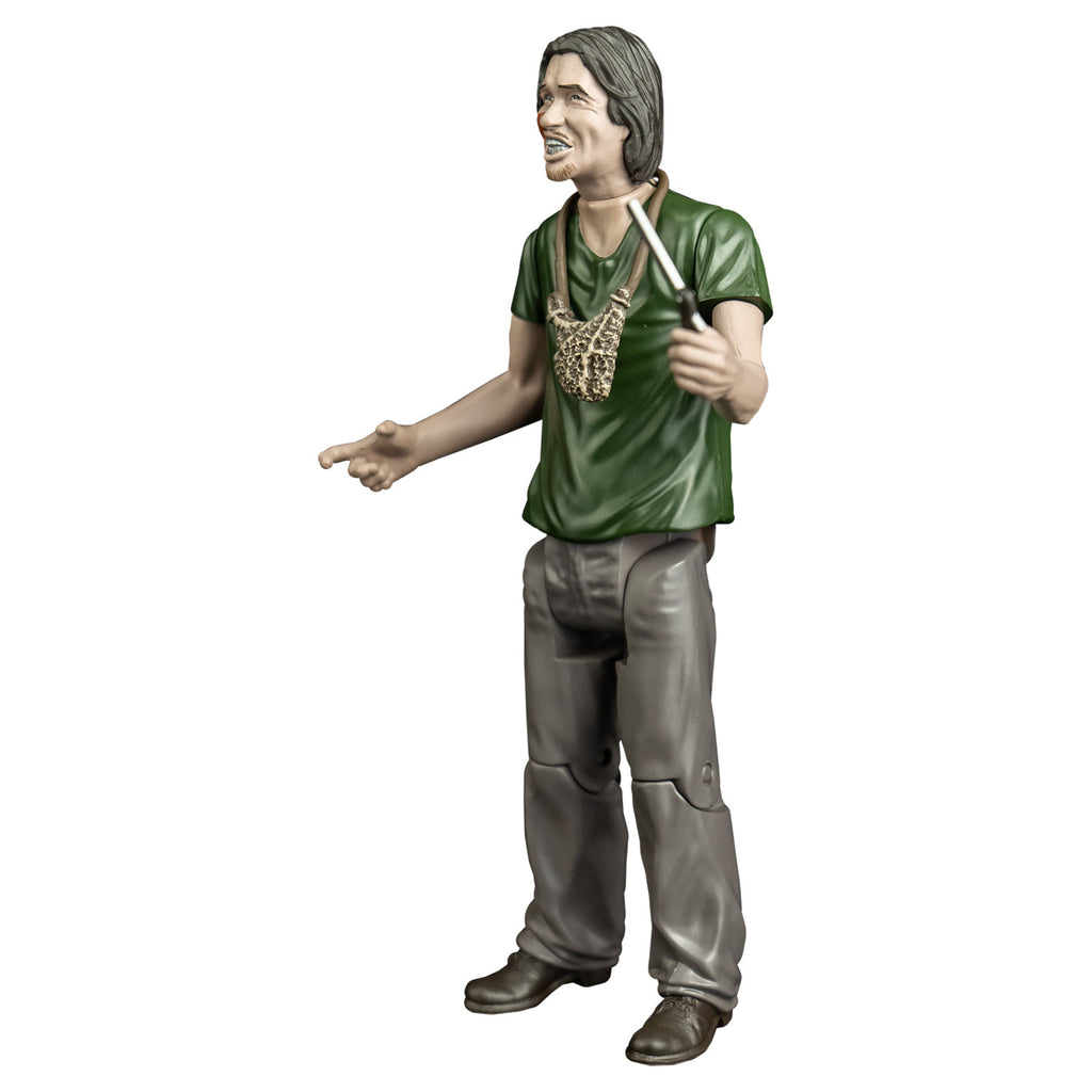 Action figure, left side view. man with mid-length brown hair, blood on right cheek, mouth with lips open showing teeth. handmade pouch hanging around his neck. wearing a green t-shirt, gray pants and brown shoes. Holding a straight razor in left hand.