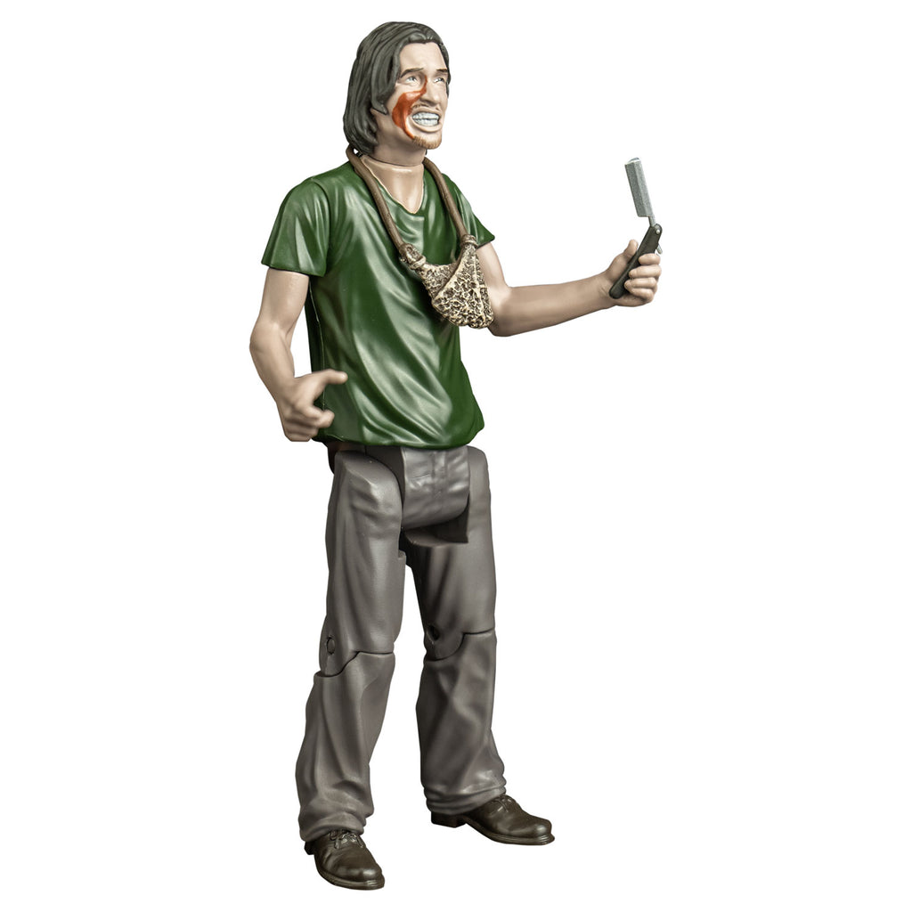 Action figure, right side view. man with mid-length brown hair, blood on right cheek, mouth with lips open showing teeth. handmade pouch hanging around his neck. wearing a green t-shirt, gray pants and brown shoes. Holding a straight razor in left hand.