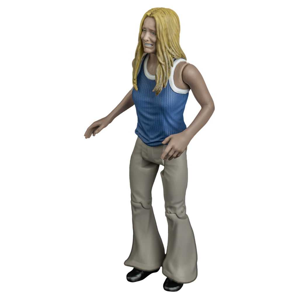 Sally figure, left side view. Blond woman, grimace on face, blue and white tank top, tan flare-legged pants.