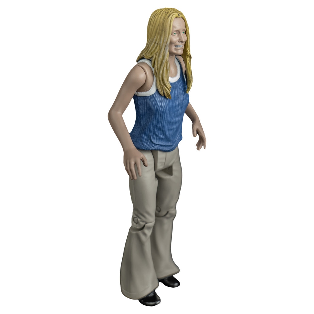 Sally figure, right side view. Blond woman, grimace on face, blue and white tank top, tan flare-legged pants.