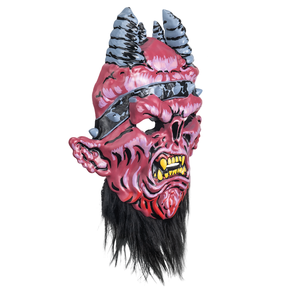 Mask, right view.  Red and pink demon-like face, wrinkled flesh.  4 gray and black horns on head.  black headband with silver spikes.  furrowed brow, snout-like nose, large pointed ears.  mouth open in a snarl, large yellow teeth and fangs.  black beard below chin