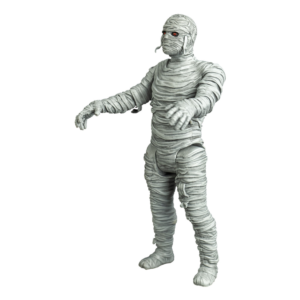 Mummy figure, left view. white bandaged head red eyes, black eye sockets. Black on tip of nose. body fully wrapped in white bandages.  arms outstretched to the front.