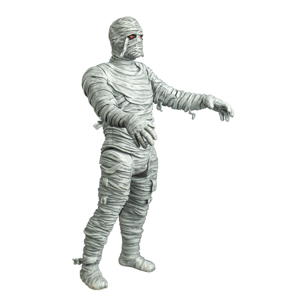 Mummy figure, right view. white bandaged head red eyes, black eye sockets. Black on tip of nose. body fully wrapped in white bandages.  arms outstretched to the front.