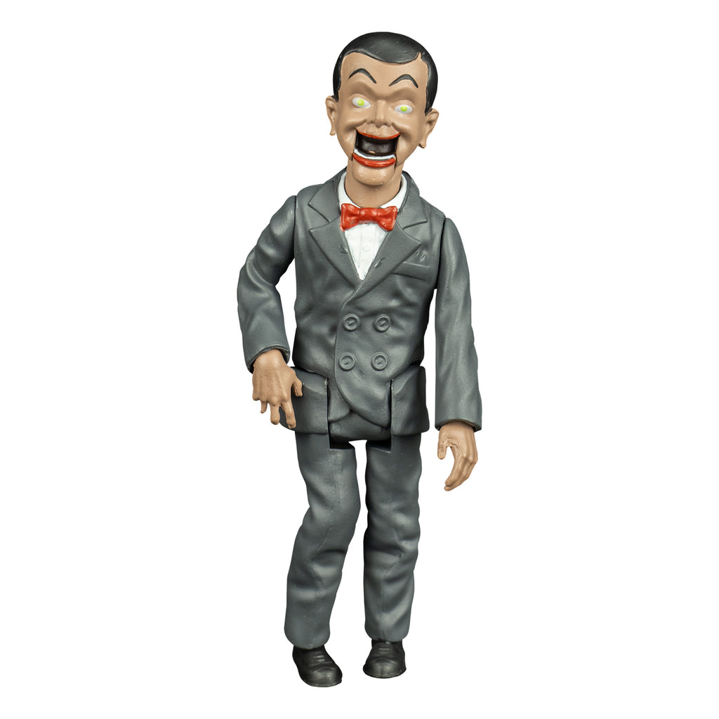 Goosebumps slappy figure, front view, Ventriloquist dummy face, dark hair and eyebrows, large yellow green eyes, bright red lips, open hinged dummy mouth showing teeth. white dress shirt, red bow tie. Gray suit coat and pants. black shoes.