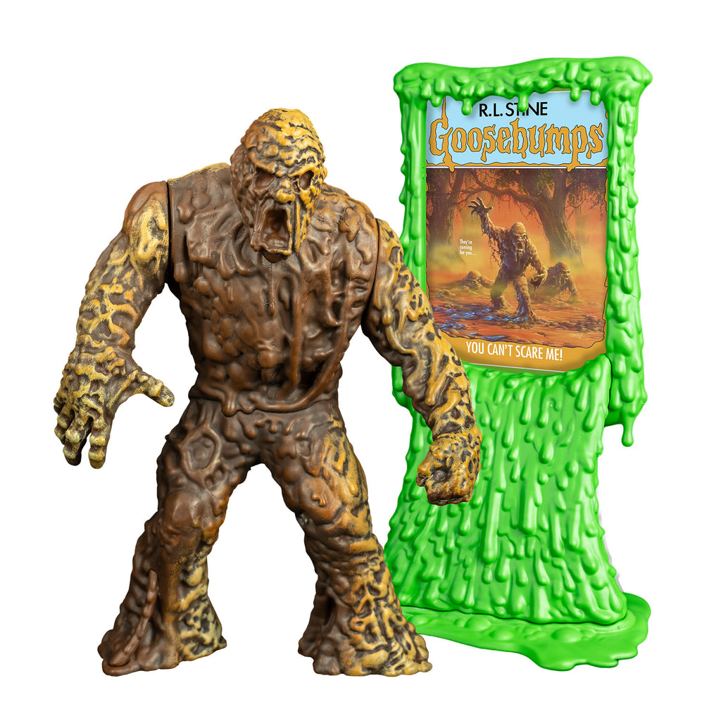 Mudmonster figure, front view. Large creature with brown mud-like flesh that appears to be dripping down. shown next to Green slime book card stand