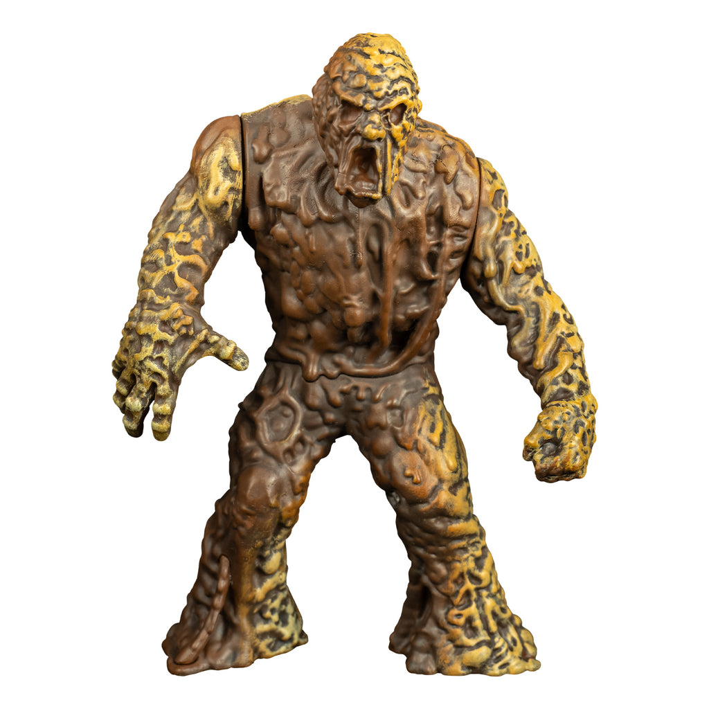 Mudmonster figure, front view. Large creature with brown mud-like flesh that appears to be dripping down.