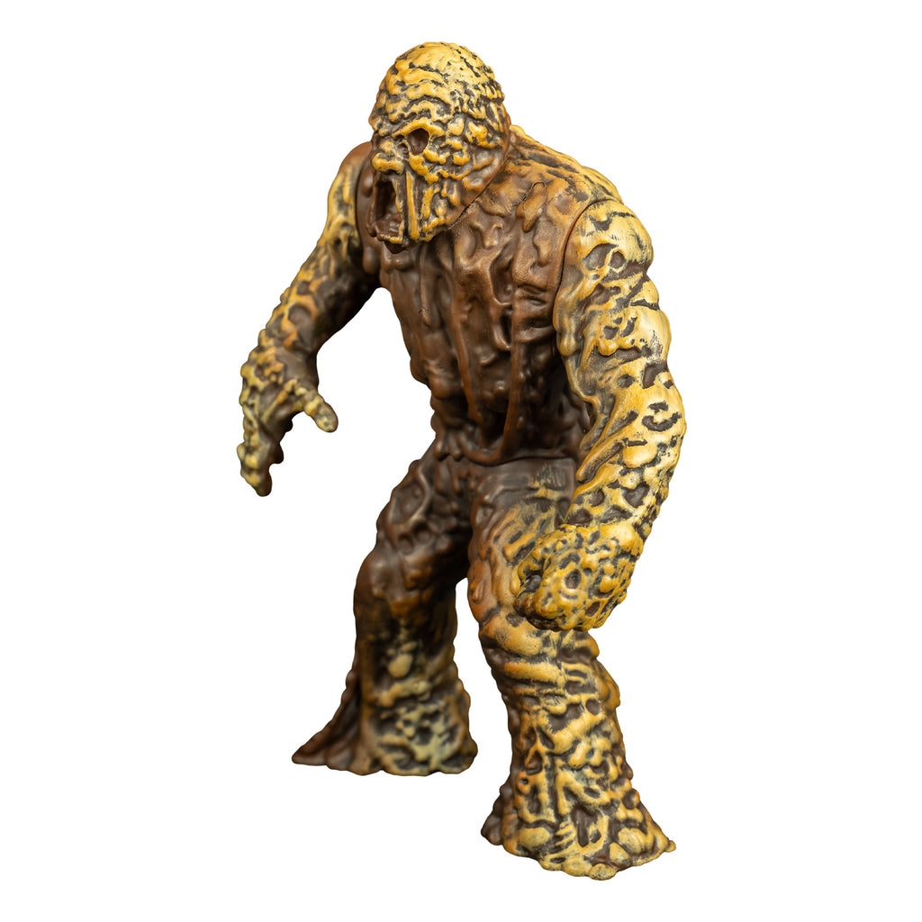 Mudmonster figure, left view. Large creature with brown mud-like flesh that appears to be dripping down.