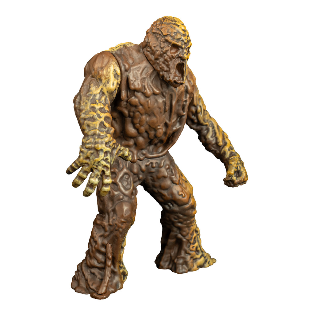 Mudmonster figure, right view. Large creature with brown mud-like flesh that appears to be dripping down.