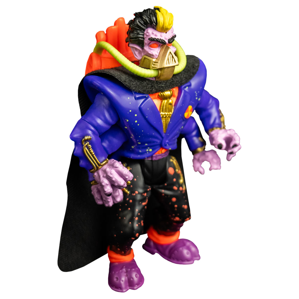 Action figure, right side view. Short black hair, yellow stripe in the center front. Pale purple bumpy flesh. Black bushy eyebrows, red eyes. gold mask, triangular over nose and mouth, horizontal bands around lower jaw, yellow hoses on sides attached to orange backpack. Wearing orange shirt with a gold tie, blue jacket, four arms, black cape, black pants with orange splatter, purple and orange shoes.