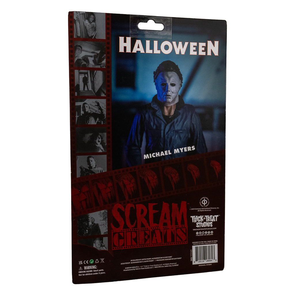 Product packaging, back view. Cardboard backing. Black and white Images from the film. Close up of the figure head and chest.  Red text reads Scream Greats.  White text reads Halloween, Michael Myers.  Licensing and manufacturing information.  