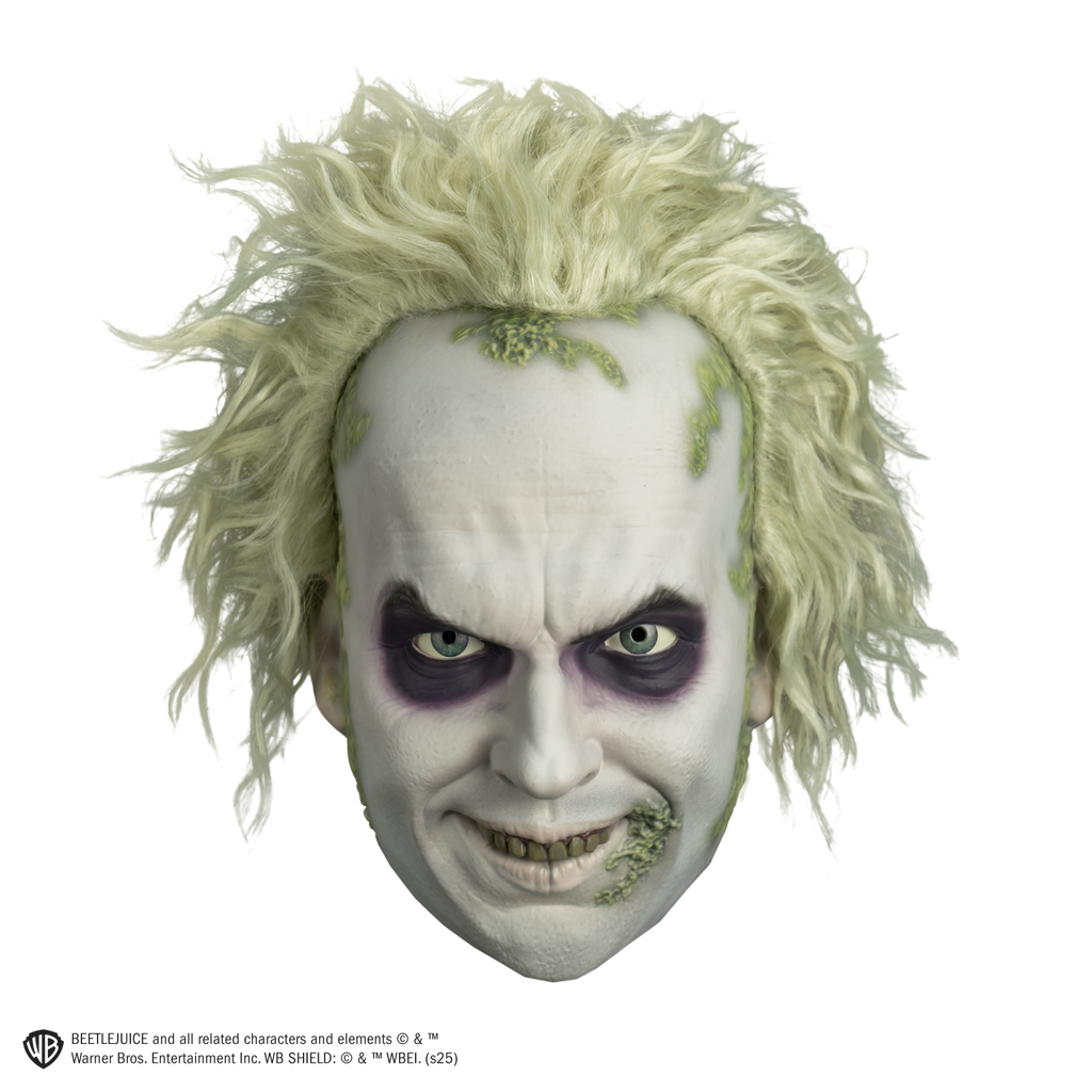 beetlejuice mask front view.  White hair and skin, wrinkled brow, black around eyes. smiling mouth showing green upper teeth.  green crusts around hairline and on left corner of mouth.