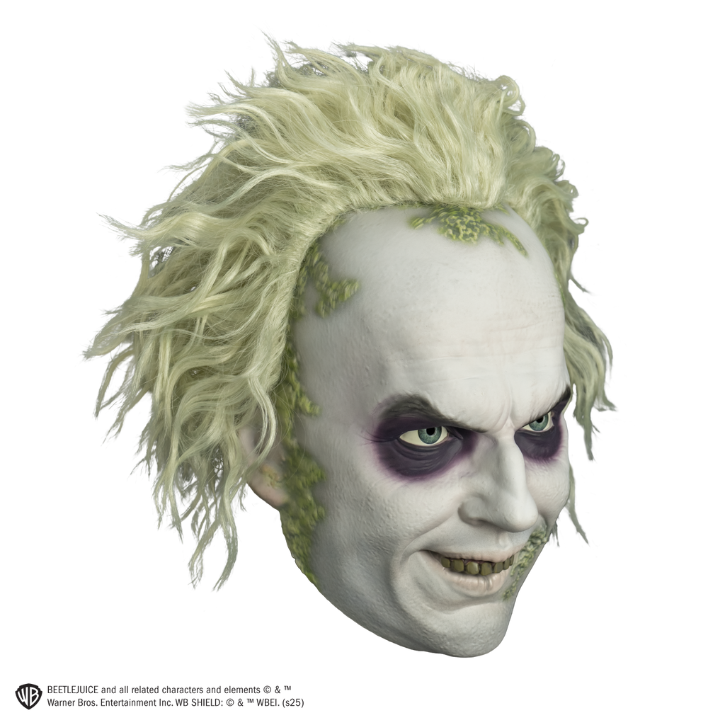 beetlejuice mask right view.  White hair and skin, wrinkled brow, black around eyes. smiling mouth showing green upper teeth.  green crusts around hairline and on left corner of mouth.