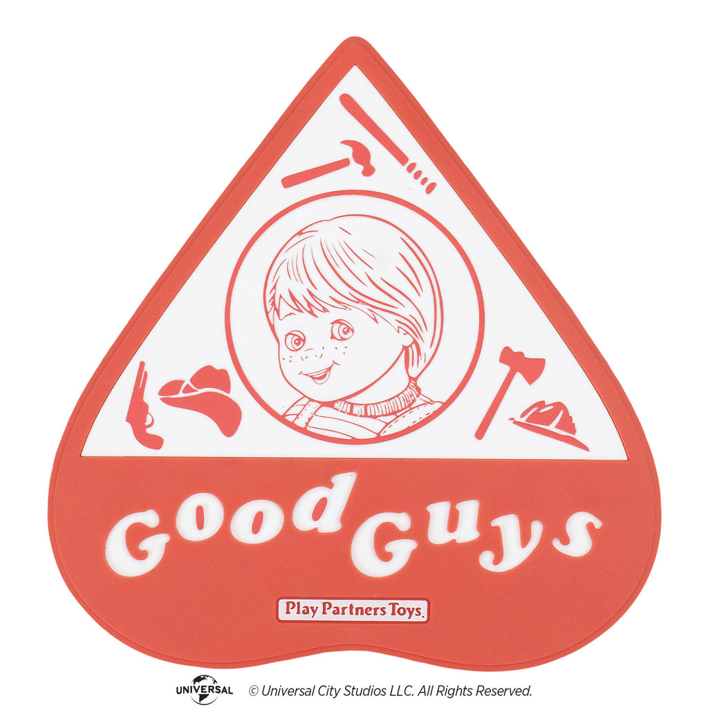 Red and white planchette. Illustration, red on white background showing good guys doll head in a circle surrounded by baseball bat, hammer, pistol, cowboy hat, axe and firefighter hat. white text on red background below reads Good Guys.  small white rectangle below, red text reads play partners toys.
