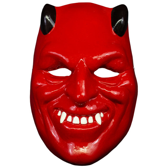Plastic mask, front view. Bright red, black horns, grinning mouth with white teeth and fangs.