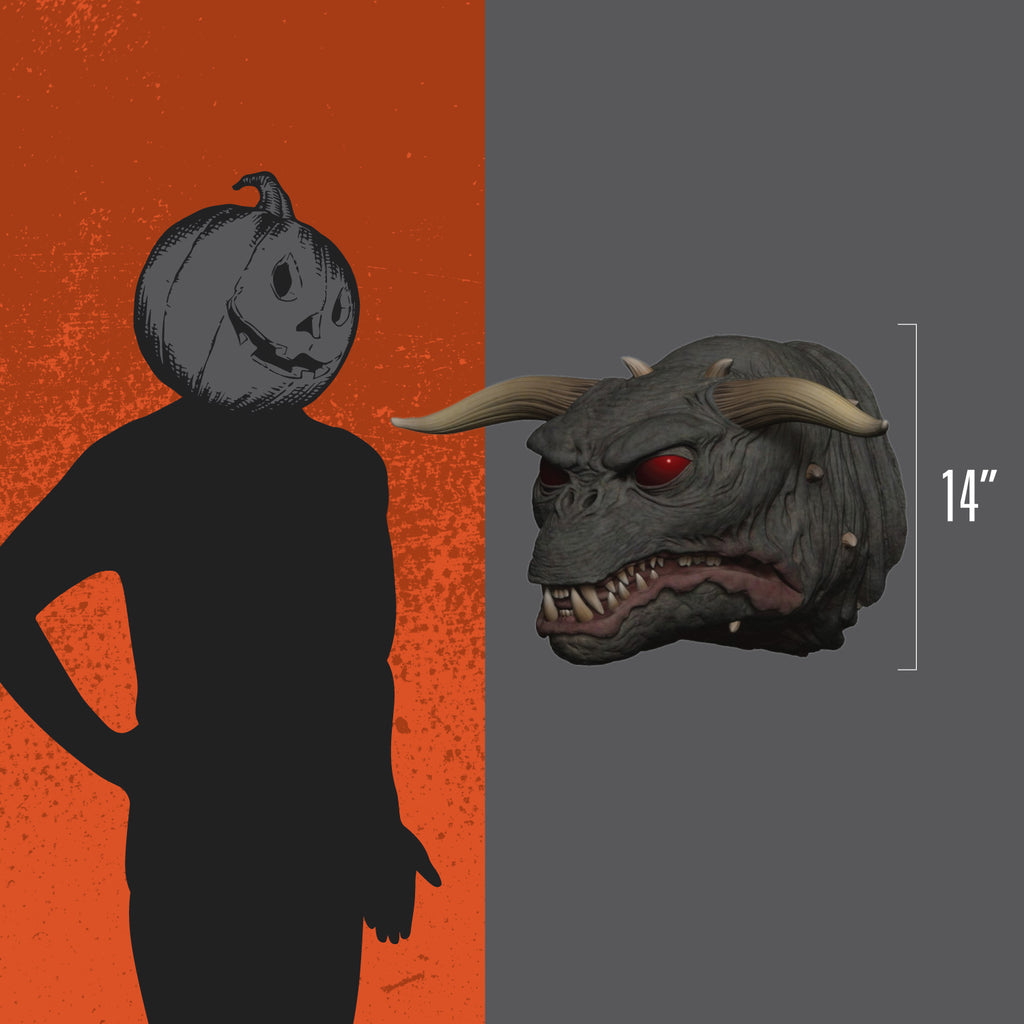 Orange and gray background. Person wearing black, gray jack o' lantern head, standing next to Wallbreaker to show size, 14 inches
