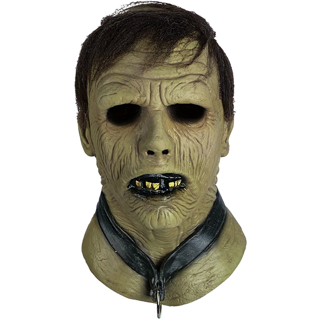 Zombie mask, front view.  Brown hair, wrinkled flesh, slightly open mouth with black lips and jagged teeth.  Wearing a black collar with metal ring.