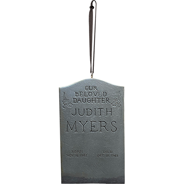 Ornament.  Gray Tombstone, text reads Text reads our beloved daughter Judith Myers, born Nov 30 1947, died Oct 31 1963.