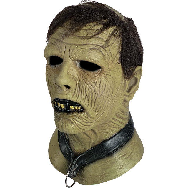 Zombie mask, left side view. Brown hair, wrinkled flesh, slightly open mouth with black lips and jagged teeth. Wearing a black collar with metal ring.