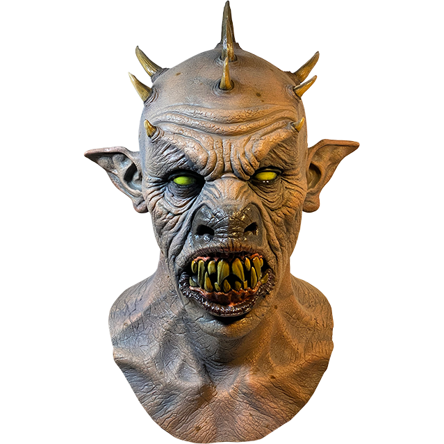 Mask, head and neck, front view. Bald demon head, 9 spikes on head, wrinkled skin.  Large pointed ears, yellow eyes, large snout. open mouth with black lips large sharp yellow teeth.