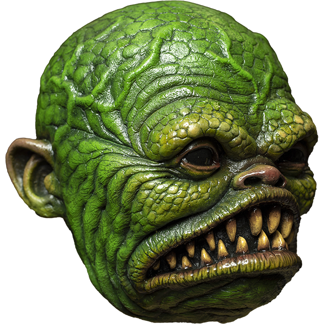 Mask, right side view. Green scaly face, bulging veins, black shiny eyes, small snub nose. Large frowning fish mouth with large sharp yellowed teeth.