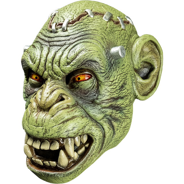 Mask, left side view. Lab chimp, Green flesh, metal staples in scalp, metal posts at temples. Yellow and red eyes, small pupils, scowling open mouth showing teeth.
