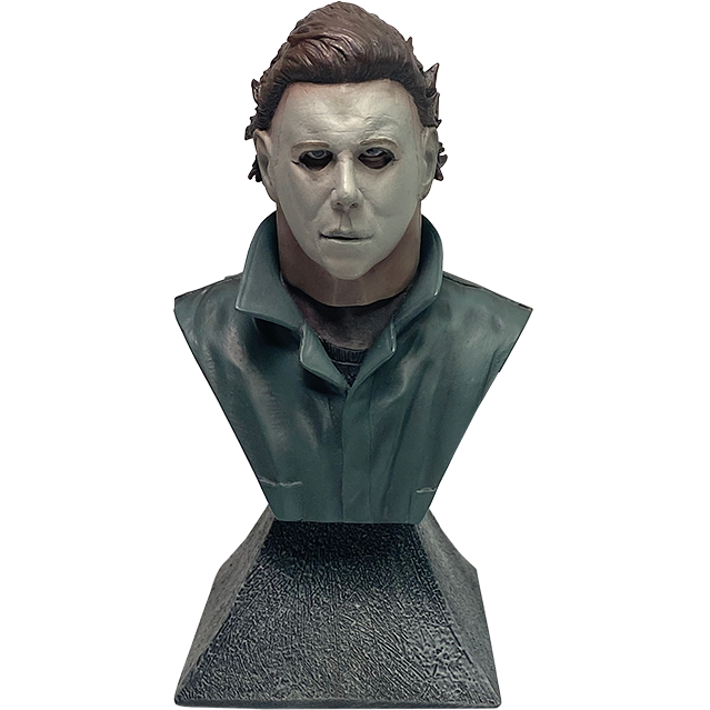 Michael Myers mini bust.  Head neck and chest, white mask, brown hair, black shirt under green coveralls.  Gray stone textured base.