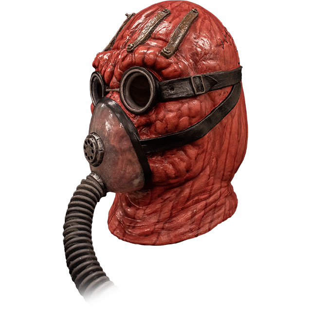Mask left side view. Lumpy red head and neck, wearing goggles and oxygen mask with black hose.