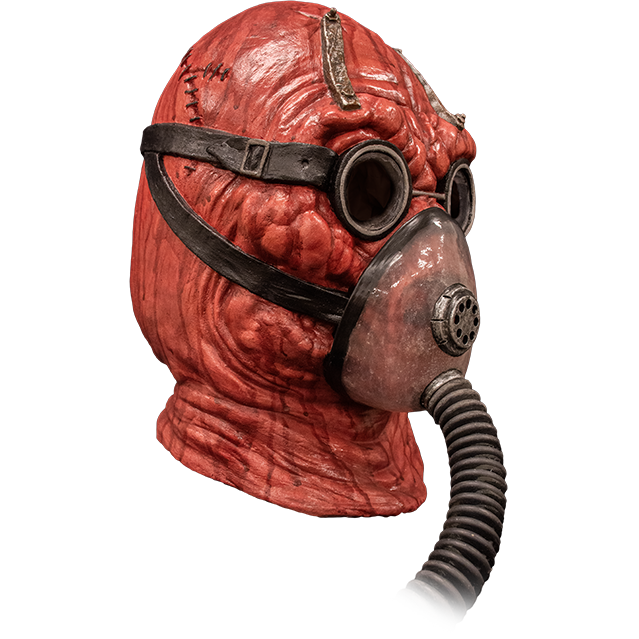 Mask right side view. Lumpy red head and neck, wearing goggles and oxygen mask with black hose.