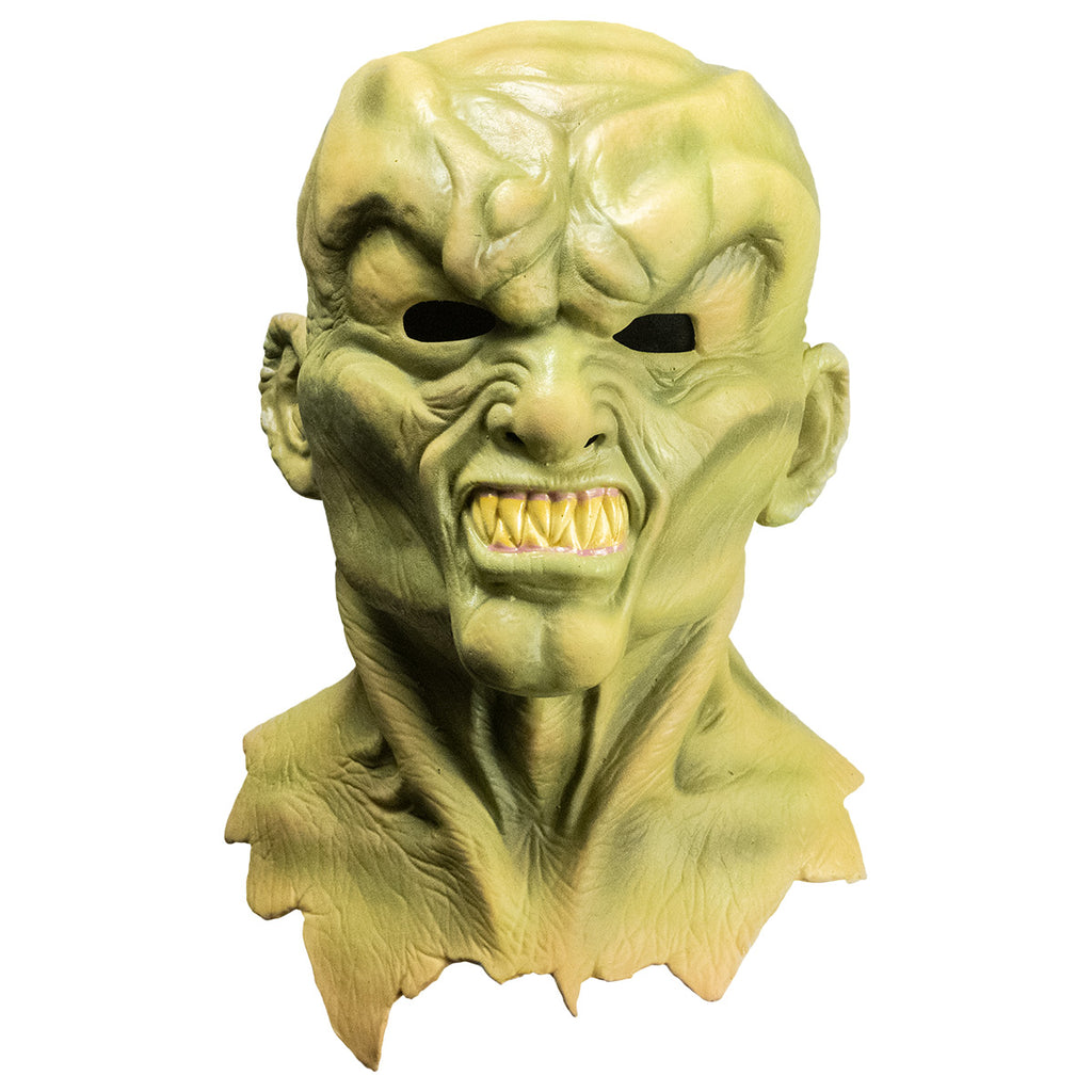 Mask, front view.  Head neck and upper chest.  Greenish flesh, lumpy, misshapen bald head, Heavy brow over angry face, snarling mouth full of large sharp teeth.  
