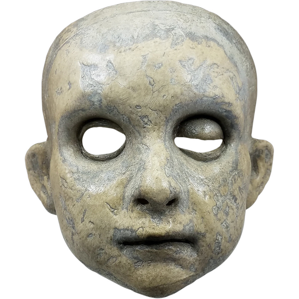 Mask.  gray and white stone textured round face, left eye half closed.  Closed mouth.