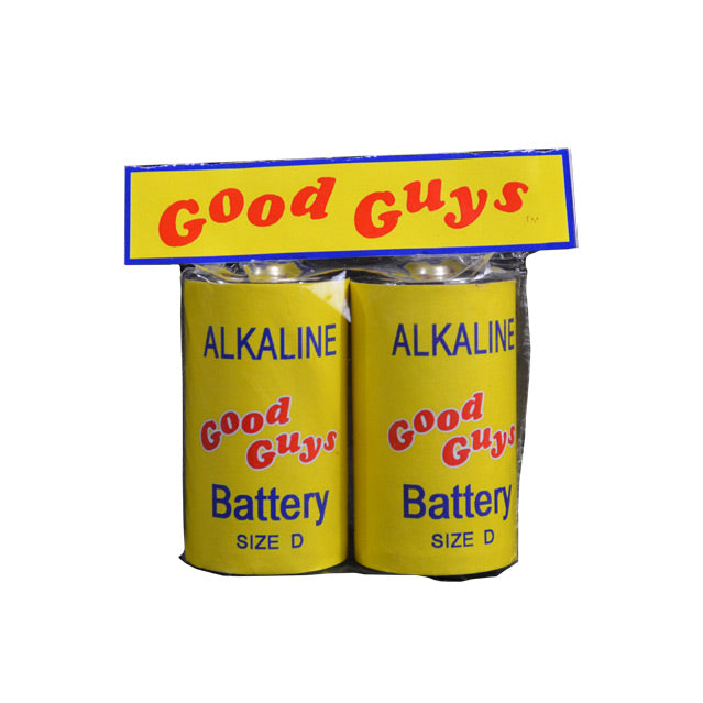 Battery Prop.  Packaging, Yellow and blue border,  with red text reading Good Guys, contains two prop batteries in clear plastic.  Each battery is silver with a yellow label,  red Good Guys logo, blue text reads Alkaline, Battery, Size D.