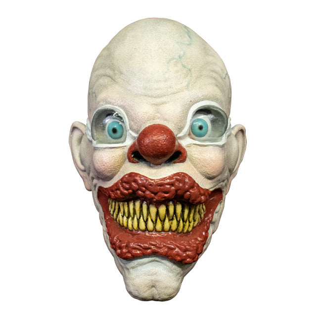 Front view.  Creepy bald clown face.  White skin with blue veins.  Light blue bulbous eyes, wearing white goggles.  Large red nose.  Enlarged, bumpy red lips, smiling.  Many sharp yellow teeth.