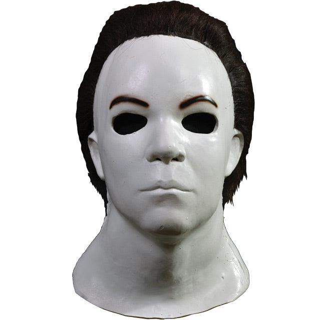 Front view Mask, head and neck. Dark brown hair, white skin.