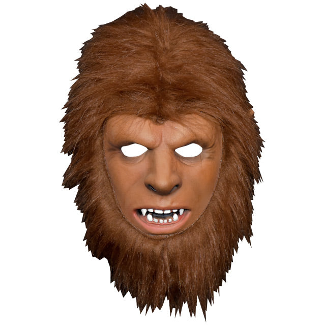 Youth werewolf mask. Human like face with werewolf teeth, surrounded by light brown fur.