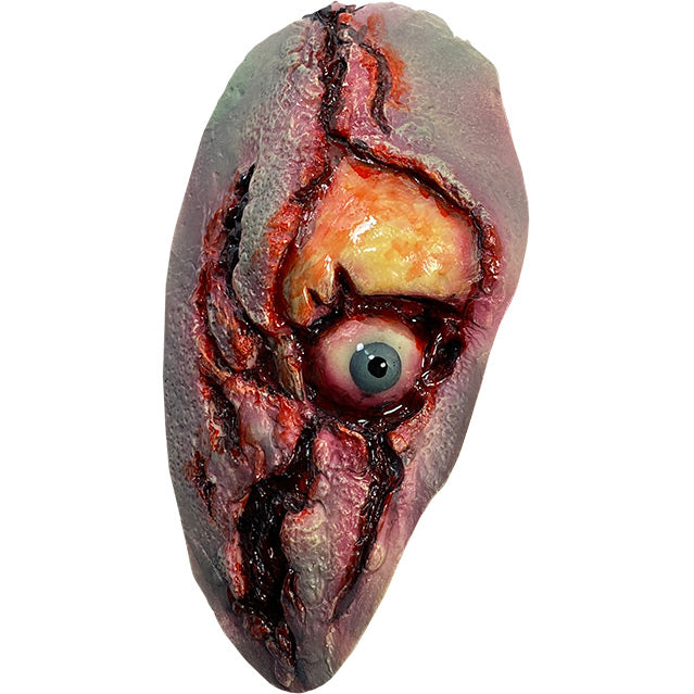 Zombie eye appliance.  Latex prosthetic piece.  Blue eye surrounded by gory flesh, brow bone exposed.  