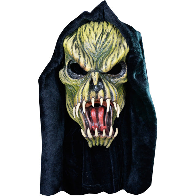 Front view. Light and dark green faced creature in black hood, wrinkled skin, wide open mouth showing tongue and several large fangs.