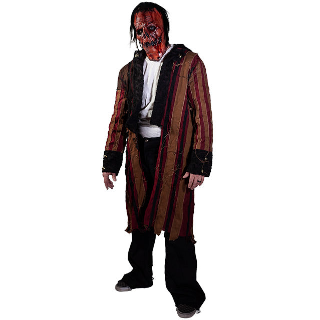 Jacob Atkins costume, man with gory orange Jack O' Lantern-like face. Wearing a white shirt, red and orange striped coat with black cuffs and sleeves, black pants, black shoes.