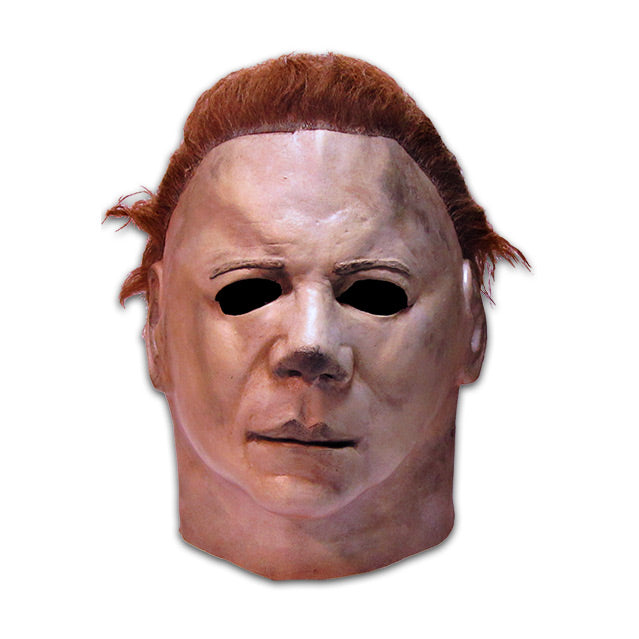 Mask, head and neck.  Brown hair, pale skin.
