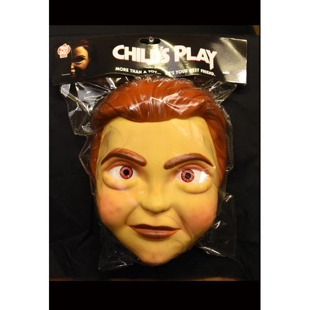 Packaging containing Buddi Vacuform mask.  Text on tag reads Child's Play, More than a toy, he's your best friend.  Mask has red-brown hair brown eyebrows, brown eyes.