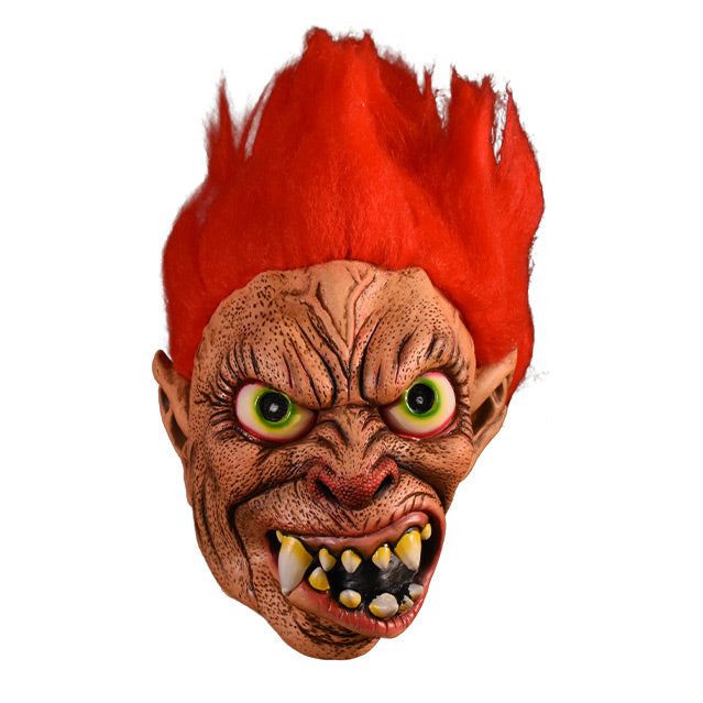 Mask.  Red spiky hair. Large pored, wrinkled skin. Big red-rimmed green eyes. Red nose.  Crooked mouth with monstrous teeth. 