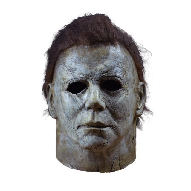 Front view, mask, head and neck. Aged and distressed white skin, dark brown hair.