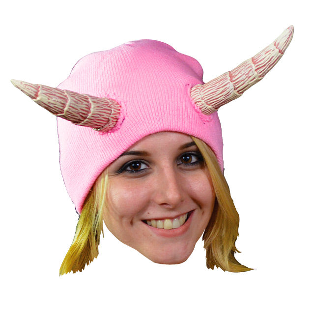 Woman wearing pink knit cap with sewn on white and pink horns.