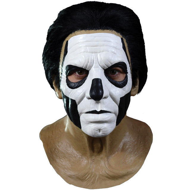Mask, front view.  Head, neck and upper chest.  Thick black hair, white painted face, with black accents to create skull like appearance.