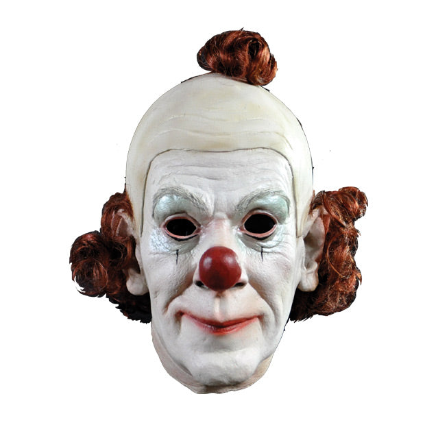 Front View.  Clown Mask.  White face, red nose, one small black line below each eye.  wig partially bald, red hair pompom on top, red curly hair around back ear to ear. 