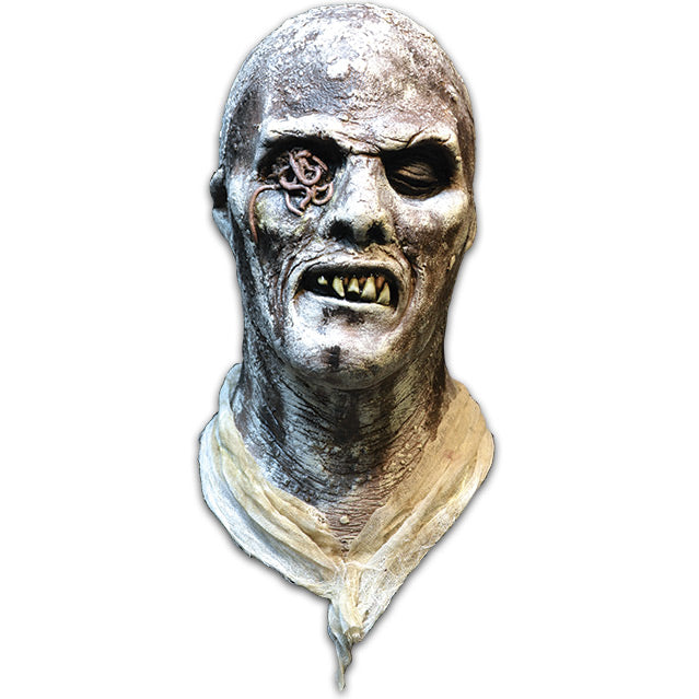 Mask, front view. Rotted zombie head and dirty rotted cloth around neck. Bald, face has rotting flesh, black eyes, right eye socket filled with worms, mouth of jagged dirty teeth.