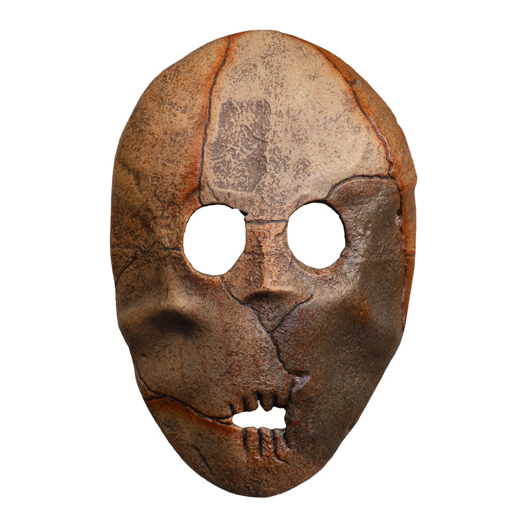 Brown face mask, indistinct facial features two eye holes, small mouth hole, cracked and worn texture.