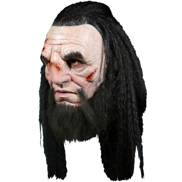 Left side view, Wun Wun mask. Head and neck. Man with wounds on face, thick bushy black eyebrows, long bushy black beard. long black hair, pulled back on top.