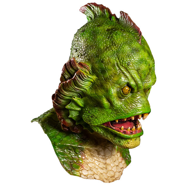 Mask right side view. Head, neck and upper chest. Humanoid fish creature. Green scales, fin in center of head, fins on each side of face. Yellow eyes. Large open fish mouth with sharp yellowed teeth.