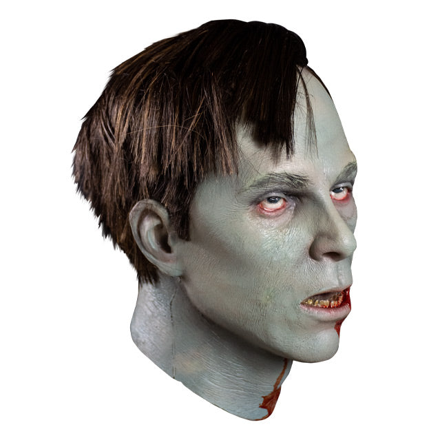 right side view. Flyboy mask, head and neck. Short brown hair, gray skin, red rimmed eyes, slack jaw open mouth showing bloody teeth and tongue. Blood on left side of mouth chin and neck..